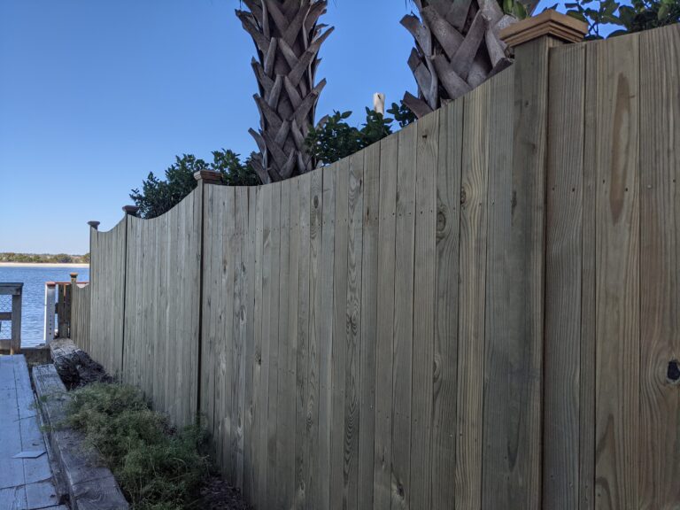 Scalloped wood fence