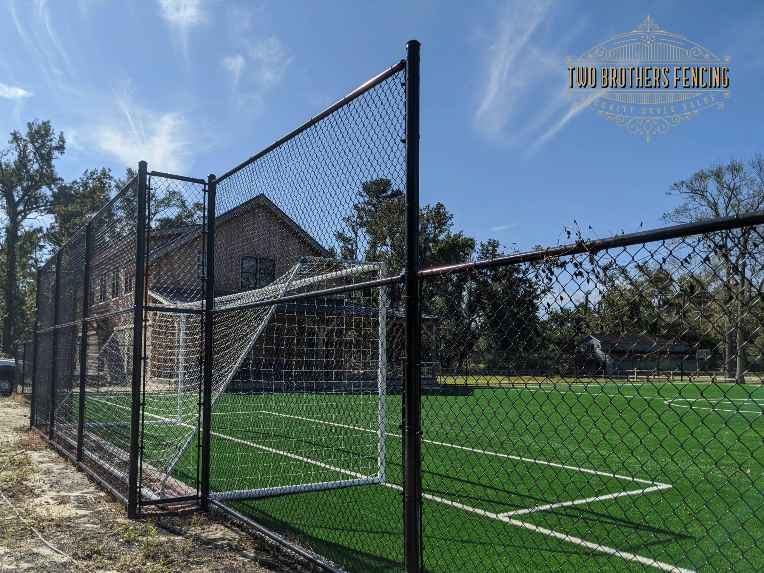Chain link fence around a soccer field sports complex